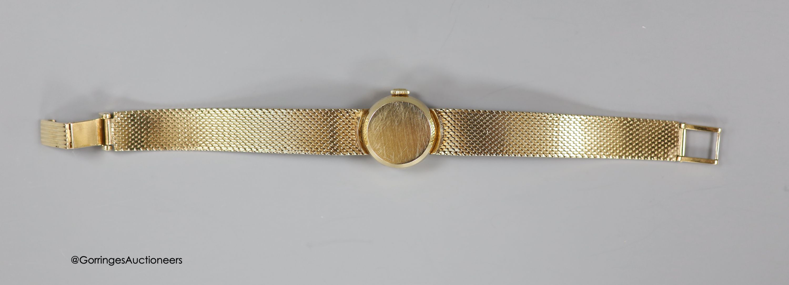 A lady's 9ct gold Longines manual wind wrist watch, on a 9ct gold bracelet, case diameter 20mm, gross weight 31.1 grams, in Longines box.